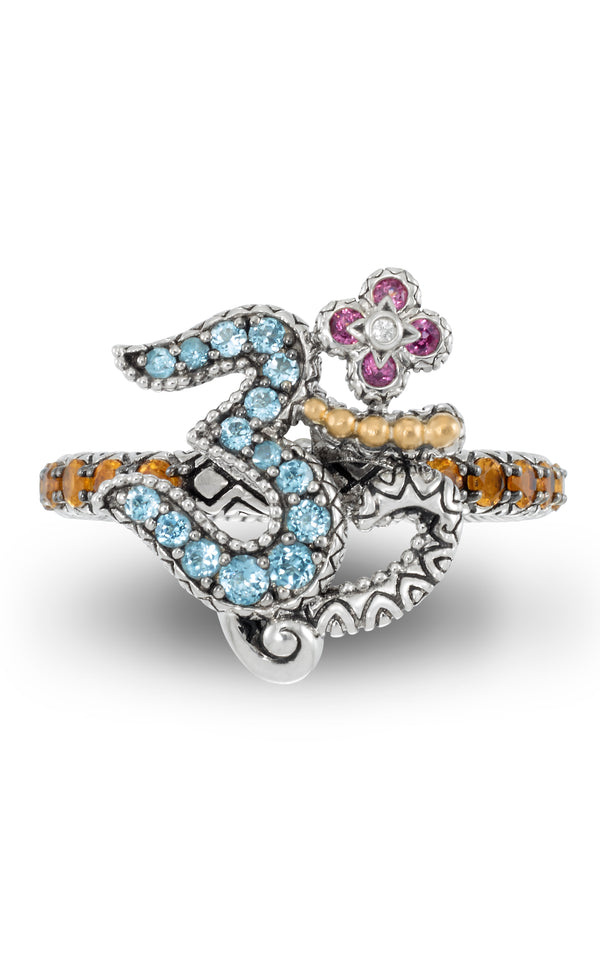 Om ring with gemstones on a white background